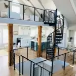 indoor steel spiral staircase from main floor to bedroom loft