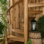 all wood spiral stair in wood panel farmhouse